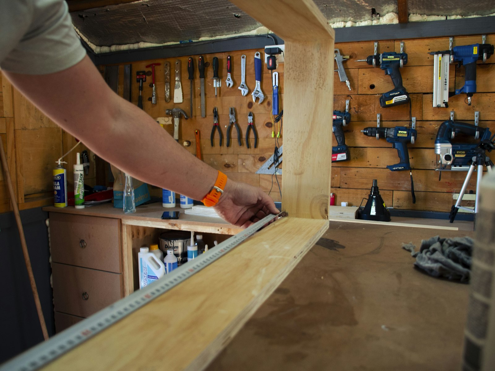 A finished edge-banded panel being checked before dispatch.